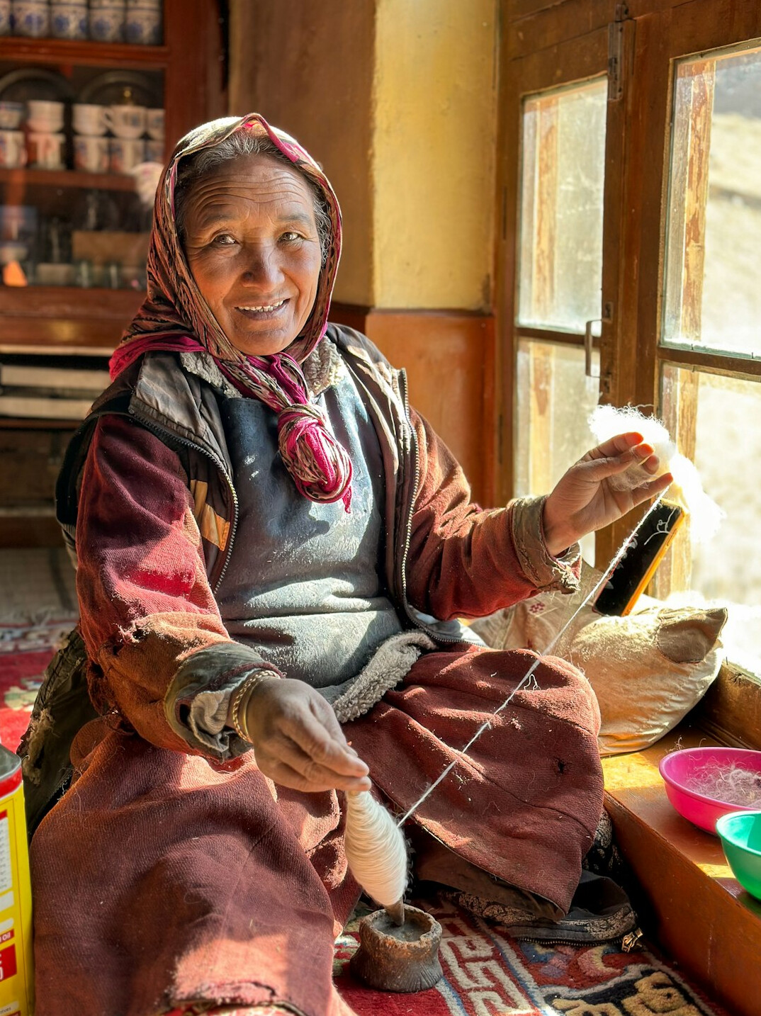 elderly woman weaving